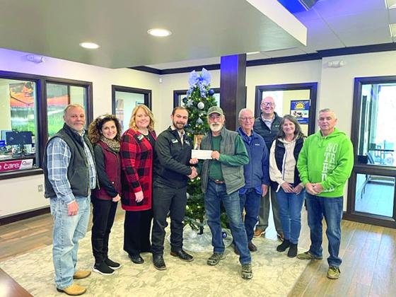 BancFirst presented a check to the McLoud Historical Society in support of fundraising efforts to further the mission of the museum. Pictured above (from left) are Dean Hill Brenda Hill, Christina Smiley, Jacob Sestak, James Metcalf, Bruce Ferrell, Casey Bell, Sylvia Metcalf, and Don Kuhn. Photo provided
