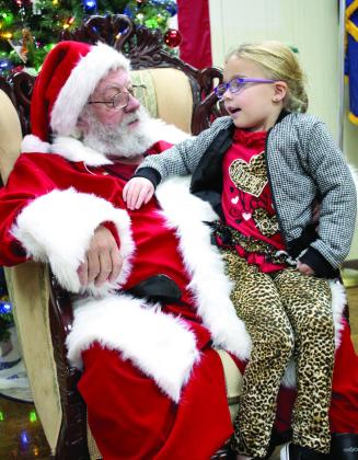 Blaire Wells, 5, of Earlsboro, talks with Santa Claus at the American Legion Post 260 in Tecumseh on Dec. 10. Countywide &amp;amp; Sun/ Natasha Dunagan