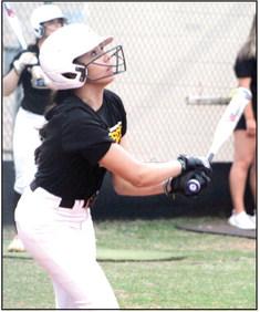 Tecumseh’s Serenity Jacoway watches to see where her ball goes in the home game against Westmoore.