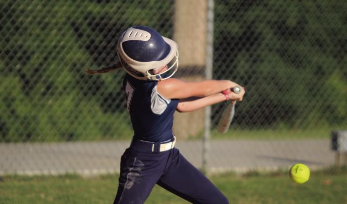 Asher sophomore Mackenzie Thompson hits a single the game against Community Christian.