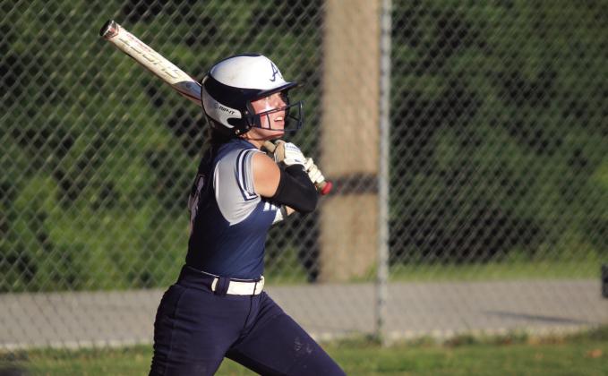 Asher junior Preslee Taylor watches the ball soar after hitting a single.