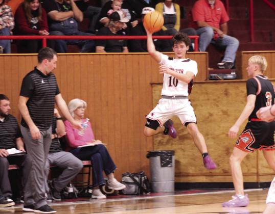 Macomb's Gerardo Flores makes a jump pass during the Nov. 18 home game against Wayne.