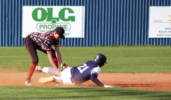 After hitting a double, Asher junior Brogan Culwell slides into second just before Maud freshman Carsyn Bodkin can tag him during the second inning he game.