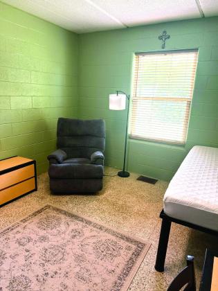 Although there is still plenty of work to be done, workers took time to stage one room of a two-room suite. Each room will have a closet, desk area and bed. Director Kelley Metcalf said program participants will be encouraged to make their space their own. Photo provided
