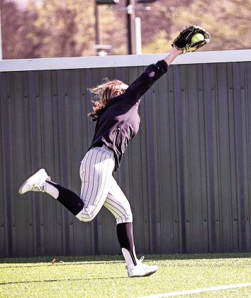 NRC's Jaden Clifton makes a running grab for the out in the first game of their season.