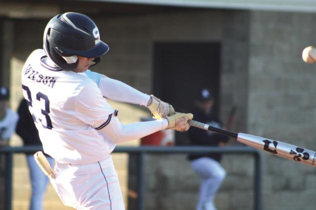 Shawnee's Zane Wilson hits a single in the first inning of the home game with Will Rogers on March 28. The Wolves won, 10-0. Countywide &amp; Sun/Natasha Dunagan
