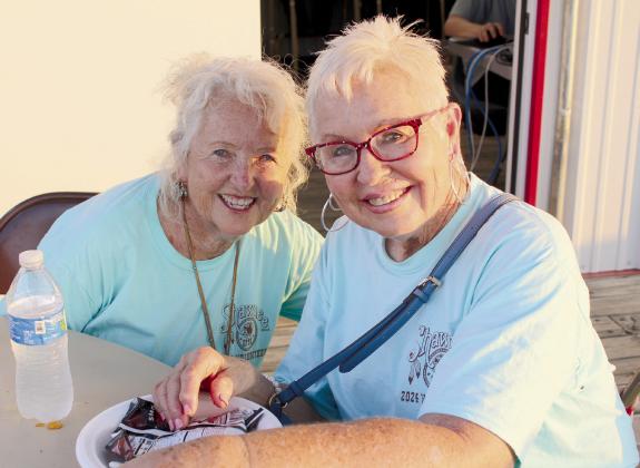 IFYR volunteers Sue Nelson and Linda Brown pose together on the last night of the rodeo, July 12. Nelson has volunteered since it was the National High School Rodeo Association, which was in Shawnee for three years over 30 years ago. Brown estimates that it has been 29 years for her. Countywide &amp; Sun/Natasha Dunagan