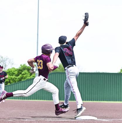 North Rock Creek's Jace Plumb stretches for the out.