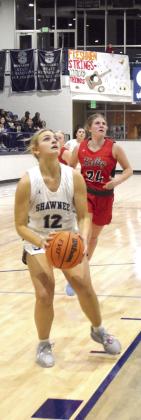 Abigail Clements shoots for two in the homecoming game against Bishop Kelley on Jan 31. The Lady Wolves won the matchup 54 -33. Countywide &amp; Sun/Julie Talton