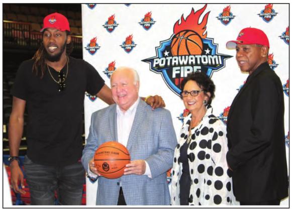 Potawatomi Fire center Anthony Allen, far left, and Head Coach Derrick Rowland, far right, pose with Citizen Potawatomi Nation Chair John “Rocky” Barrett and CPN Vice Chair Linda Capps during a press conference announcing the formation of the Potawatomi Fire by CPN and The Basketball League at FireLake Arena on Sept. 29. Countywide &amp;amp; Sun/Natasha Dunagan