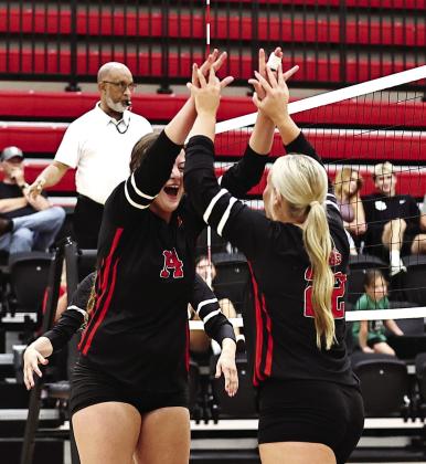 NRC athletes celebrate big after a kill by Amy Haynes.