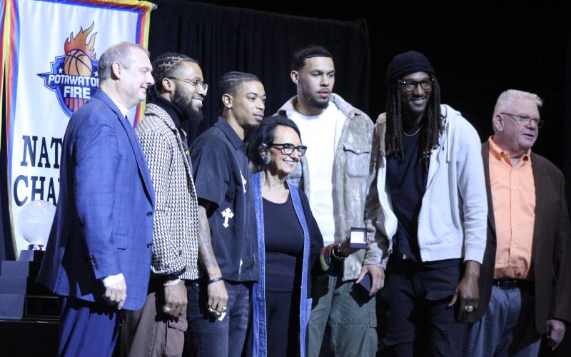 Potawatomi Fire Vice-Chairman accepts a TBL national championship ring pendant for her support, during their Third Annual Banquet and Ring Ceremony on Feb. 19. Shown, from left, are Head Coach Mark Dannhoff, Assistant Coach Emmanuel Toney, Chuck Guy, Capps, Isaiah Wade, Jay Hedgeman, and FireLake Arena General Manager David Qualls. Natasha Dunagan, Countywide &amp; Sun