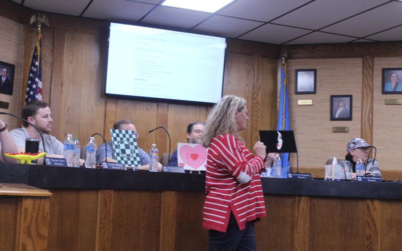 Jefferson Elementary Principal Jennifer Epperley explains one of the six student art pieces she brought to show the Shawnee Board of Education on Feb. 9.