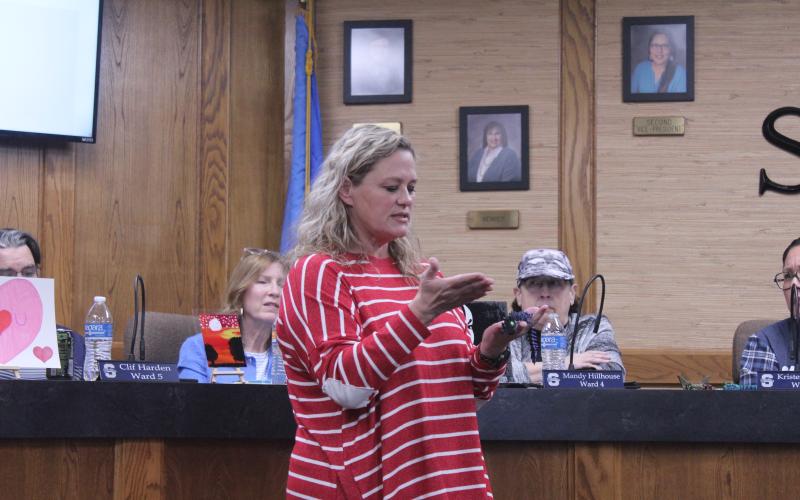Jefferson Elementary Principal Jennifer Epperley explains one of the six student art pieces she brought to show the Shawnee Board of Education on Feb. 9.