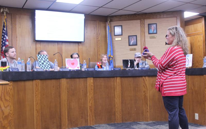Jefferson Elementary Principal Jennifer Epperley explains one of the six student art pieces she brought to show the Shawnee Board of Education on Feb. 9.