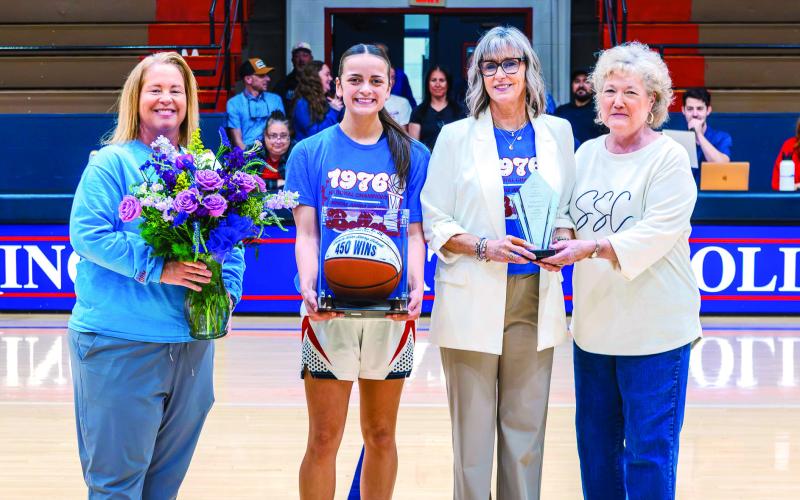 Seminole State College Women’s Basketball Head Coach Rita Story-Schell was honored during the Belles’ home game Monday, Feb. 16, after earning her 450th career win with a Feb. 12 victory over Western Oklahoma State College in Altus. Pictured (left to right): Athletic Director Leslie Sewell, sophomore forward Alona Cooper-Rochovitz, Story-Schell and SSC President Lana Reynolds. Photo Provided