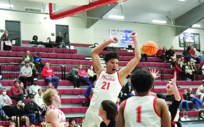 Dale junior Keldan Meely celebrates after a slam dunk during the Class 2A District home game against Luther on Feb 19. The Pirates won, 94-18, advancing to the Regional Tournament hosted by Dale beginning Feb. 24. Cheyanna Dietz, Countywide &amp;amp; Sun Intern
