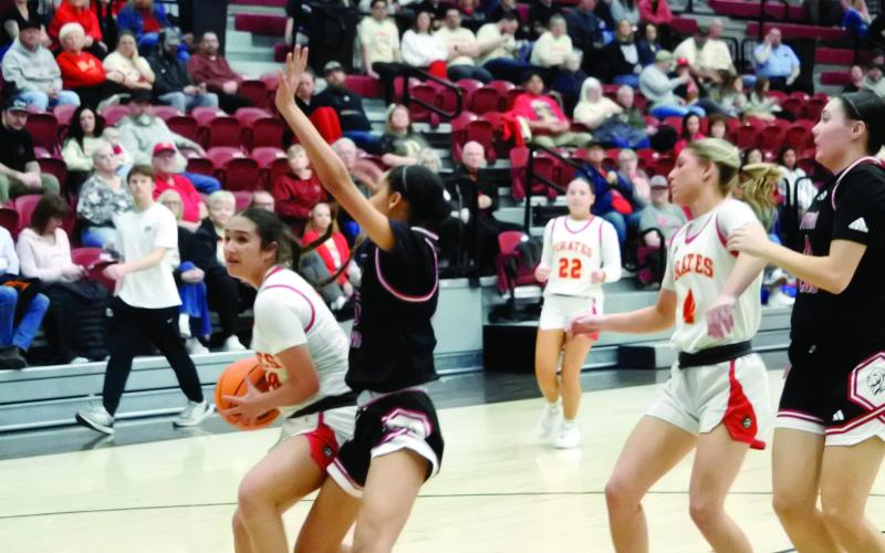Dale freshman Addison Hill guards the ball as she prepares to make a basket at the Class 2A District home game against Luther on Feb 19. The Lady Pirates won with a final score of 71-14, and they advanced to the Regional Tournament hosted by Dale, beginning Feb. 24. Cheyanna Dietz, Countywide &amp;amp; Sun Intern