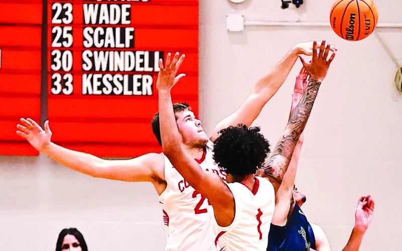 Jace Plumb blocks the Kingfisher shot in the Feb. 28 Regional Championship Game.