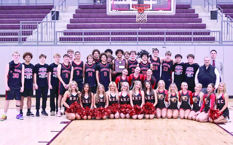 NRC boys claim the Area Championsip, beating Catoosa, 69-54, and moved on to State play on Mar. 10. NRC lost a buzzer beater against Fort Gibson to end their season at the new OG&amp;amp;E Coliseum. See next week's issue for those photos. Photo Courtesy of Gowin Photography