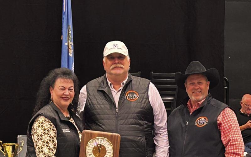 Ricky Thompson (center) is honored for his years of dedication to the Pottawatomie County Junior Livestock Show. The award is presented by Suzanne Gilbert (left) and Matt Griffith (right). Suzie Campbell, Countywide &amp; Sun