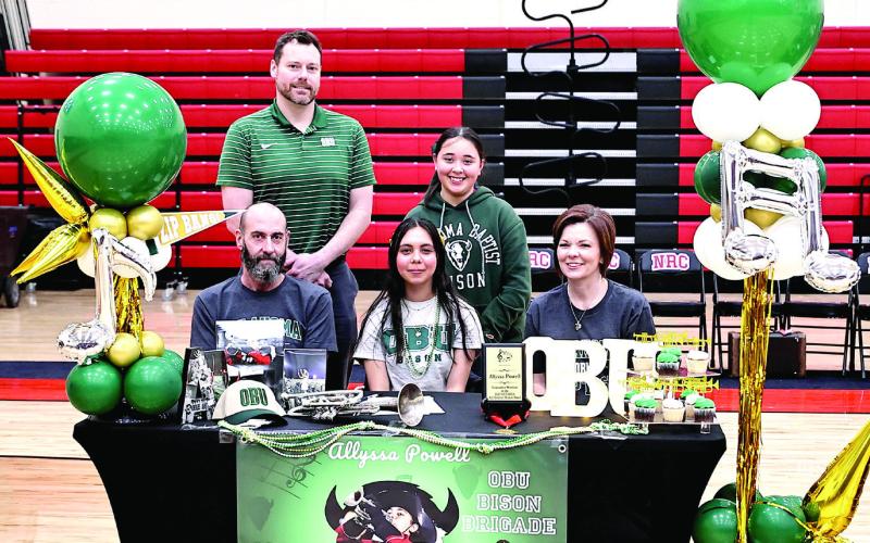Allyssa Powell signs with OBU band, with her parents, Becki and David, and sister Emma Powell &amp;amp; Dr. Brian Stackhouse, OBU Athletic Band. Photo Courtesy of Gowin Photography