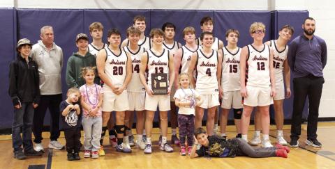 The Asher Indians, their coaches and a few of their biggest fans pose with their Class B2 District Championship trophy after winning the home game against the Oklahoma School for the Deaf on Feb. 13. The Indians won, 62-38, and advanced to the Regional Tournament in Maud on Tues., Feb. 17. The Lady Indians also won their District game and would play in Regionals. Photos by Natasha Dunagan, Countywide &amp; Sun