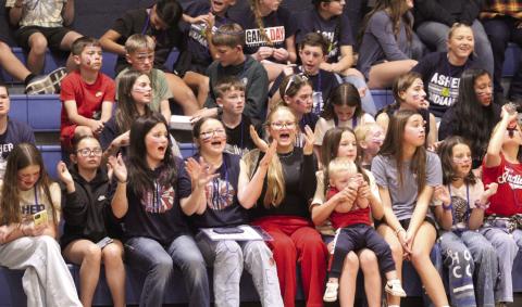 The Asher student section supports the Indians with the 'Miss It' chant, as the other team shoots foul shots, during the Feb. 13 District home game against the Oklahoma School for the Deaf.