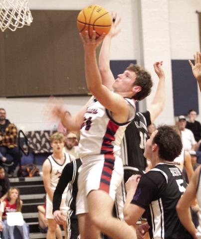 Asher's Greyson Wood makes his shot in the Feb. 13 District home game against the Oklahoma School for the Deaf.