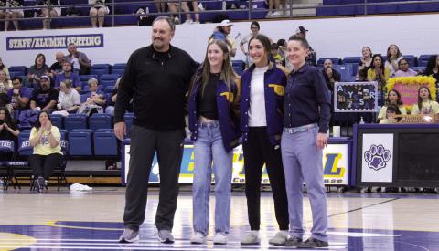 Bethel's Lilly Jordan and Layla Menhusen received their Fast Pitch Softball All-State jackets during halftime of the Wildcats' game on Feb. 6. Presenting the jackets are Fast Pitch Assistant Coach David Griffin, far left, and Fast Pitch Head Coach Tara Satterfield.