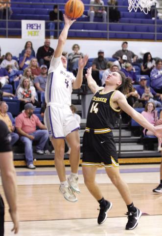 BHS junior Maddox Davis goes up for a bucket and is fouled by THS junior Cashawn Thompson in the first quarter.