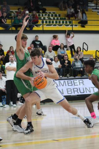 Bethel senior Bronc Robbins drives past a Jones defender during the first quarter of the home game on Feb. 13. The Wildcats won by one point, 56-55. On Feb. 17, they beat Okmulgee to win Districts, 65-63. Today (Feb. 23) they will play at Prague in Regionals at 7:30. Countywide &amp; Sun/Natasha Dunagan