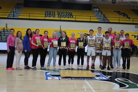 After the home court kissing ceremony, Bethel's basketball seniors received plaques with pieces of their home court, as well.