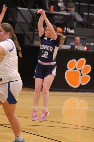 Asher junior Makaylee Harrell shoots a trey in the Class B2 Regional Tournament Round One game against Bowlegs, at Maud on Feb. 17. The Lady Indians won that game, 67-24, but lost Round Two against McCurtain on Feb. 21, 37-52. They advance to the Area Tournament on Feb. 26 (today), 6 pm, at the Mvskoke Dome.
