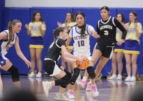Tecumseh sophomore Sosi Mitchell dribbles around Bethel senior Layla Menhusen during the second quarter of the Feb. 6 homecoming game at Bethel.