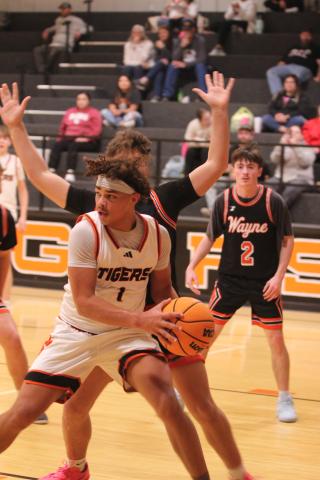Maud freshman Koi Street looks for an opening to pass during second quarter of the Feb. 5 home game against Wayne. The Tigers won 62-48.