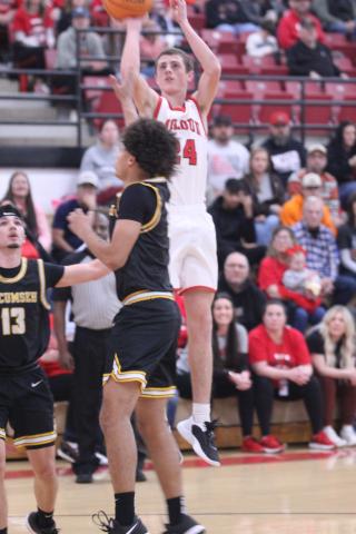 McLoud's Eli Nemecek tries for three points during the Class 4A District Tournament home game against Tecumseh on Feb. 21. The Redskins won 73-54 and advanced to the Regional Tournament on Feb. 24. The Savages will play Madill in the Regional Consolation Bracket today (Feb. 26) in McLoud at 7:30 pm.