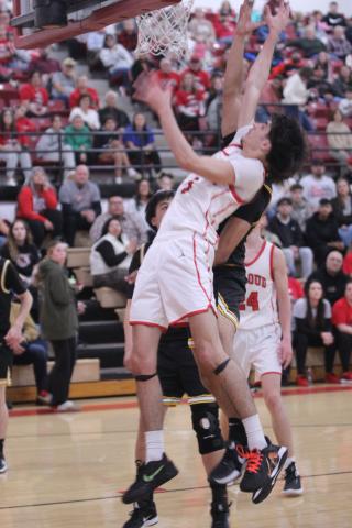 McLoud's Grayson Yousey puts up a shot and gets fouled during the Class 4A District Tournament home game against Tecumseh on Feb. 21.