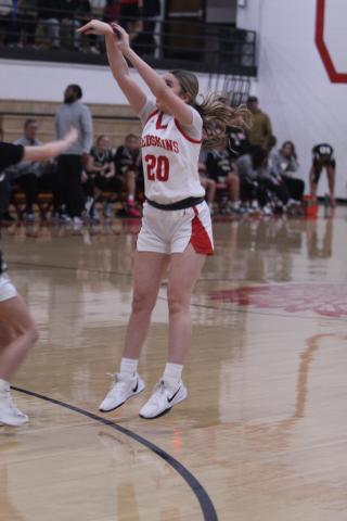 McLoud's Riley Post launches a three-pointer during the fourth quarter of the Class 4A District Tournament home game against Tecumseh on Feb. 21. The Lady Redskins won 79-30, and advanced to the Regional Tournament at home on Feb. 24. The Lady Savages play Ada in the Regional Consolation Bracket today (Feb. 26) in McLoud at 6 pm.
