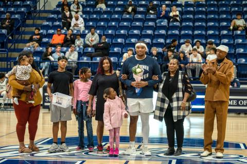 Ja'Qwon Evans poses with his family during the Shawnee High School Basketball Senior Night Ceremony, which was held between the girls and boys games on Feb. 13. Other seniors who were recognized were Aidon Siqueiros, Daley Rice, Aanyiah Lambert, Tarilyn Thierry, Jocelyn Hayes and Aniya Kowena. Photo courtesy of Shawnee Public Schools