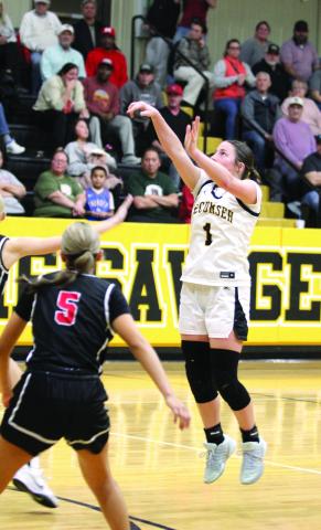 Tecumseh senior Cadence Leba launches the ball from beyond the arc and adds three points during the third quarter of the Feb. 3 home game with McLoud. The Lady Savages lost 20-83.