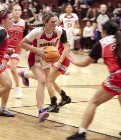 Macomb's Addy Beauchamp drives toward the bucket during the Feb. 10 home game against Sasakwa.