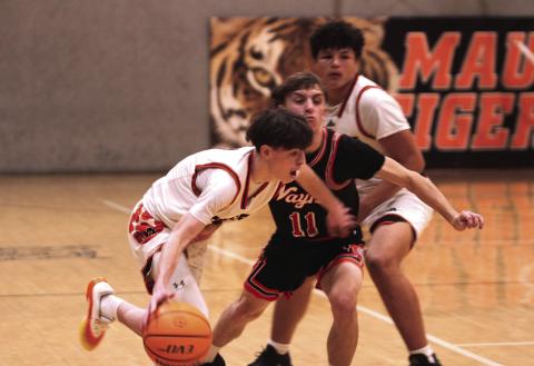 Maud senior Colt Abbott guards the ball and takes it upcourt during the Feb. 5 home game against Wayne. The Tigers won 62-48.