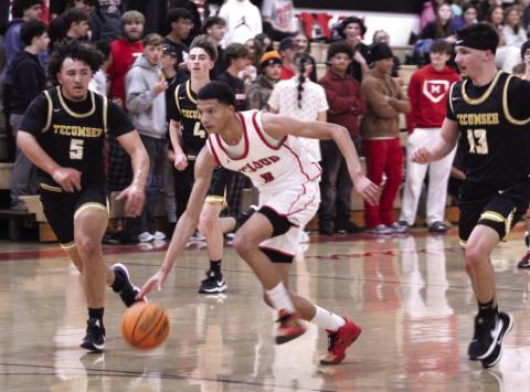 McLoud's Ladamien Williams take it upcourt, while followed by three Tecumseh defenders - Aveon Stokes, Brodey Wood, and Creed Wright - during the Class 4A District Tournament home game against Tecumseh on Feb. 21. The Redskins won 73-54 and advanced to the Regional Tournament on Feb. 24. The Savages will play Madill in the Regional Consolation Bracket today (Feb. 26) in McLoud at 7:30 pm.