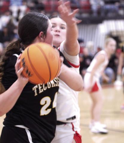 Tecumseh's Lilie Tracy guards the ball from McLoud's Anna Sharp during the Class 4A District Tournament home game on Feb. 21. The Lady Redskins won 79-30, and advanced to the Regional Tournament at home on Feb. 24. The Lady Savages play Ada in the Regional Consolation Bracket today (Feb. 26) in McLoud at 6 pm.