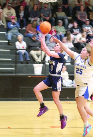 After stealing the ball, Asher junior Kenzie Thompson adds two points in the Class B2 Regional Tournament Round One game.