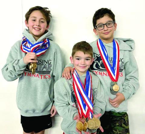 Luke Mailloux, Jackson Bottoms and Otavio Volpe, all from Shawnee, pose with medals they won at the Bart Conner Invitational in Norman on Feb. 8. Photo Provided