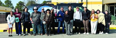 A group of Tecumseh juniors pose with Chase Rutledge and the Storm Chaser from KOCO news during the career fair on March 3. Cheyanna Dietz, THS Intern
