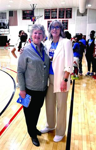 '76 Seminole Junior College Champion Belle Carole Carter poses with now-Head Coach Rita Story-Schell during the halftime 50th Anniversary celebration of the 1967 National Championship team. Carter is a 1974 graduate of Dale High School and Story-Schell is a 1982 graduate of Bethel High School. Suzie Campbell, Countywide &amp;amp; Sun