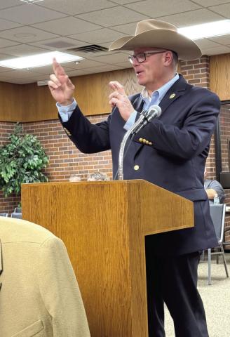Police Chief JR Kidney gives his report to the Tecumseh City Council and crosses his fingers after stating his department was about to be fully staffed. Julie Talton, Countywide &amp; Sun